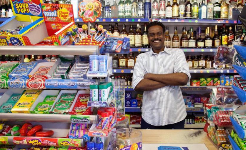 Grocer in his shop